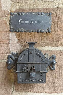 Old, iron donation box on the church wall, Bavaria, Germany, Europe