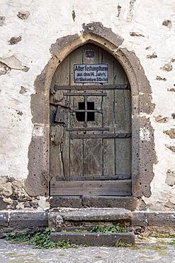 Weathered wooden door, entrance to historical dungeon, dungeon, medieval prison in the town tower, Old Town, Lich, Wetterau, Hesse, Germany, Europe