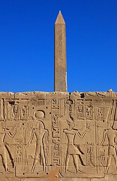 Luxor, Karnak Temple, wall with hieroglyphs, representations and symbols and obelisk in the temple complex at Karnak, UNESCO World Heritage Site, Egypt, Africa