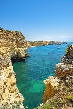 Turquoise sea, steep coast, Praia da Marinha beach, rugged rocky coast of sandstone, rock formations in the sea, Algarve, Lagos, Portugal, Europe