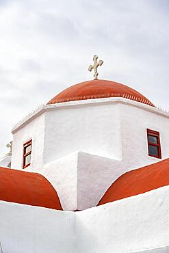 Red dome of a white Cycladic Greek Orthodox church, Mykonos Town, Mykonos, Cyclades, Greece, Europe