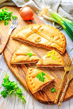 Empanada Gallega - traditional pie stuffed with tuna, Galician and Spanish cuisine. Tart with tuna and vegetables