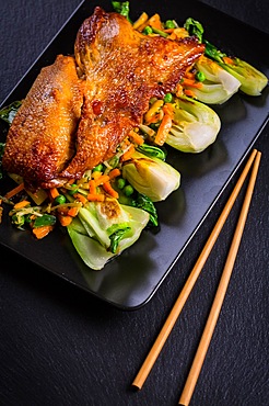 Delicious Peking duck breast with pak choi and vegetables