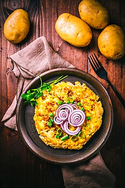 Tortilla - spanish omelette with potatoes and onions on wooden background