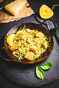 Lemon Chicken Pasta in cast iron pan with basil and Parmesan