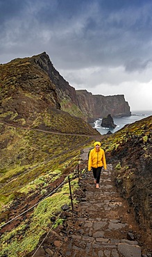 Hiker, coastal landscape, cliffs and sea, rugged coast with rock formations, Cape Ponta de Sao Lourenco, Madeira, Portugal, Europe