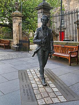 Life-size statue of the Scottish poet Robert Fergusson in front of Canongate Kirk, Royal Mile, Edinburgh, Scotland, United Kingdom, Europe