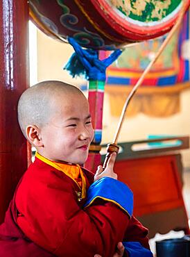 Happy young lama in Buddhist temple. Mongolia, Mongolia, Asia