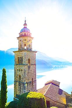 Church Tower Santa Maria del Sasso with Sunlight and Mountain on Lake Lugano in Morcote, Ticino in Switzerland