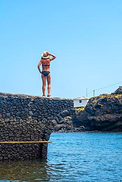 Portrait of a young woman on vacation in the village of Tamaduste on the island of El Hierro, Canary Islands, Spain, Europe