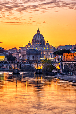 Sunset over the Basilica of St. Peter and the Tiber in Rome