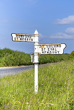 Old signposts with place names on a country road in North Cornwall, England, Great Britain