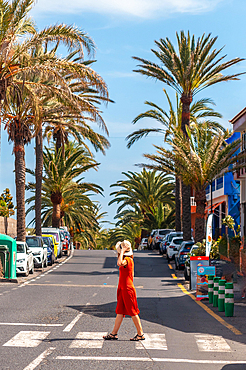 Tourist walking through the town of Valle Gran Rey on La Gomera, Canary Islands