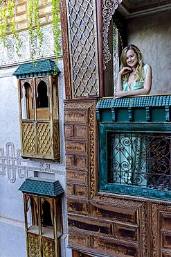 A gorgeous model poses inside a home environment