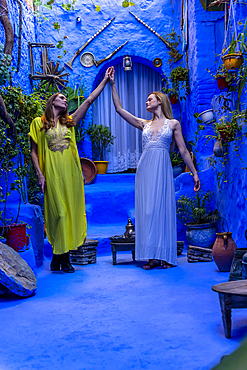 A model poses in the Blue City of Chefchaouen, Morocco, Africa