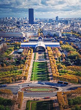 Scenery view to the Paris city from the Eiffel tower height, vertical background. Montparnasse tower and Les Invalides seen on the horizon, France, Europe