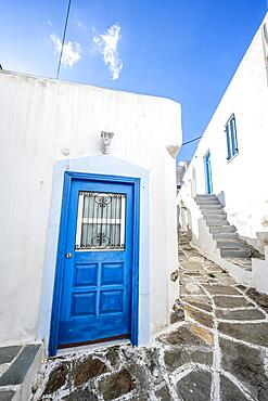 White Cycladic houses with blue windows and doors, picturesque alleys of the village of Lefkes, Paros, Cyclades, Greece, Europe