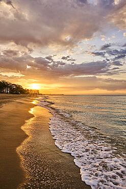 Sunrise with morning colors on a sandy beach near Tarragona, Catalonia, Spain, Europe