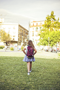 Schoolgirl walking city park