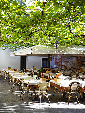 Tables laid out in a restaurant in the old town, Grado, Friuli Venezia Giulia, Italy, Europe