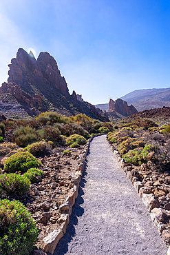 Beautiful path between the Roques de Gracia and the Roque Cinchado in the natural area of Teide in Tenerife, Canary Islands