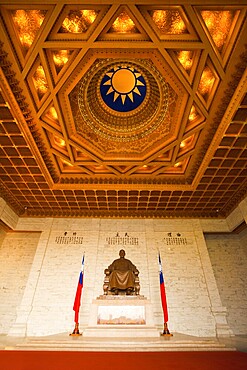 A beautifully ornate ceiling and a statue of Chiang Kai Shek inside the cavernous Memorial Hall in Taipei, Taiwan, Asia