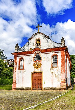 Small baroque chapel deteriorated by time in the historic city of Ouro Preto, Ouro Preto, Minas Gerais, Brazil, South America