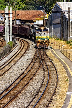 Train loaded with iron ore crossing the city in Minas Gerais, Brazil, Belo Horizonte, Minas Gerais, Brazil, South America