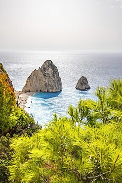 Viewpoint with a view of a landscape on a coast with Mediterranean flair. Taken in the morning light with sun and haze over the sea. the Myzithres Rock, Ionian Island of Zakynthos, Greece, Europe