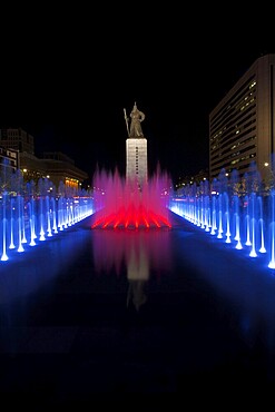 A beautifully colored fountain illuminates the Admiral Yi Sun-Sin statue in downtown Seoul, South Korea, Asia