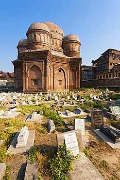 Graves surround the Tomb of Budshah, a popular tourist attraction in Srinagar, Kashmir, India. Vertical