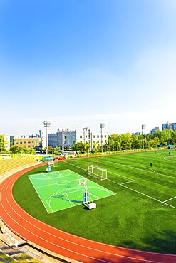 High angle view of artificial turf on the athletic soccer field at the track stadium and campus at Korea University in Seoul, South Korea. Vertical