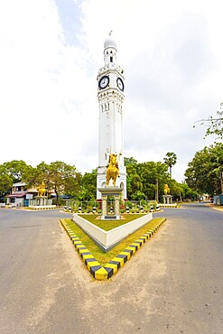 Golden horse mounted statue at intersection of white clock tower, a major landmark in downtown Jaffna, Sri Lanka, Asia