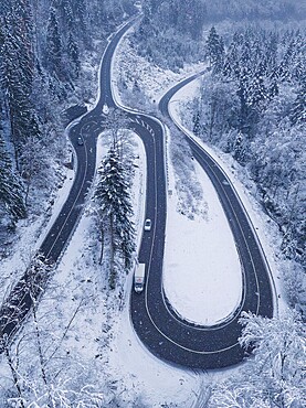 Overview of a snow-covered roundabout in the forest from the air, Calw Hirsau, Black Forest, Germany, Europe