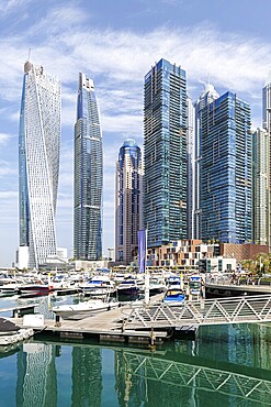 Dubai Marina skyline skyscrapers with yachts property skyscrapers living on the waterfront in Dubai, United Arab Emirates, Asia