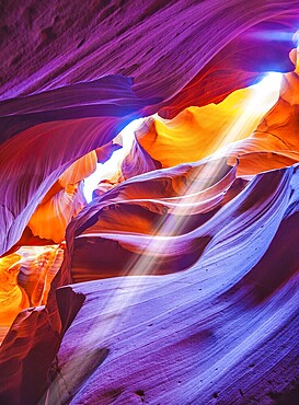 The Navajo reservation, Arizona, USA. Magic sunbeam in multi-colored slot-hole Antelope canyon