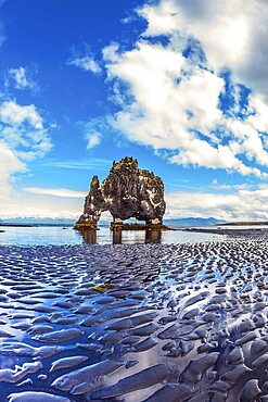 Concept of northern extreme tourism. Magic Rock Hvitsercur at sunset. Northern coast of Iceland