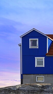 Typical architecture of Greenland Ilulissat with colored houses located near fjords and icebergs