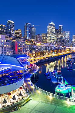 Elevated view of Seattle skyline and restaurants in Bell Harbour Marina at dusk, Belltown District, Seattle, Washington State, United States of America, North America