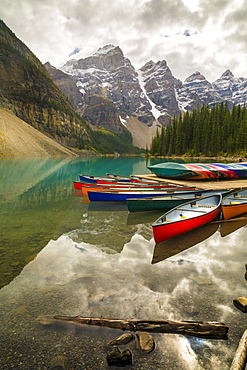 Tranquil setting of rowing boats on Moraine Lake, Banff National Park, UNESCO World Heritage Site, Canadian Rockies, Alberta, Canada, North America