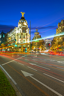 View of trail lights on Calle de Alcala and the entry to Gran Via at dusk, Madrid, Spain, Europe