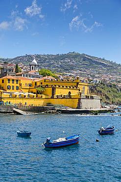 View of fishing boats in harbour and St. James Fort, Funchal, Madeira, Portugal, Atlantic, Europe