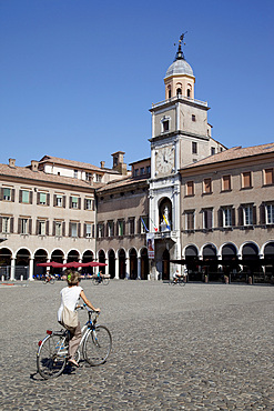 Clock Tower, Piazza Grande, UNESCO World Heritage site, and cyclist, Modena, Emilia Romagna, Italy, Europe