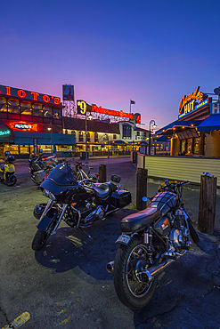 Motorbikes outside Fishermans Wharf cafes and restaurants at dusk, San Francisco, California, United States of America, North America