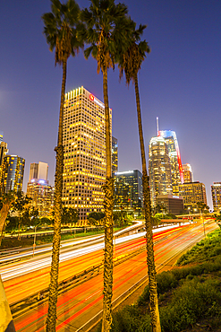 View of Downtown skyline and Harbour Freeway at dusk, Los Angeles, California, United States of America, North America