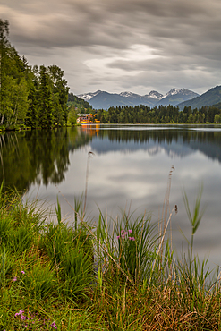 Lake side bar and mountainous backdrop at Schwarzsee near Kitzbuhel, Tyrol, Austria, Europe