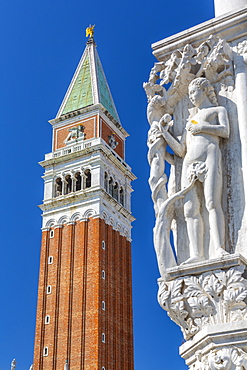 View of the Campanile and sculpture on Doge's Palace in St. Mark's Square, Venice, UNESCO World Heritage Site, Veneto, Italy, Europe