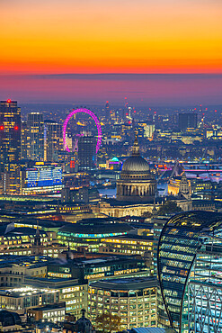 View of London Eye and St. Paul's Cathedral at dusk from the Principal Tower, London, England, United Kingdom, Europe