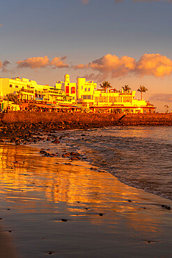 View of beach and cafes and bars during golden hour, Playa Blanca, Lanzarote, Canary Islands, Spain, Atlantic, Europe