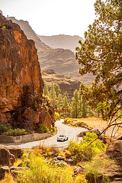 View of car driving through mountainous landscape near Barranco de Mogan, near the village of Mogan, Gran Canaria, Canary Islands, Spain, Atlantic, Europe